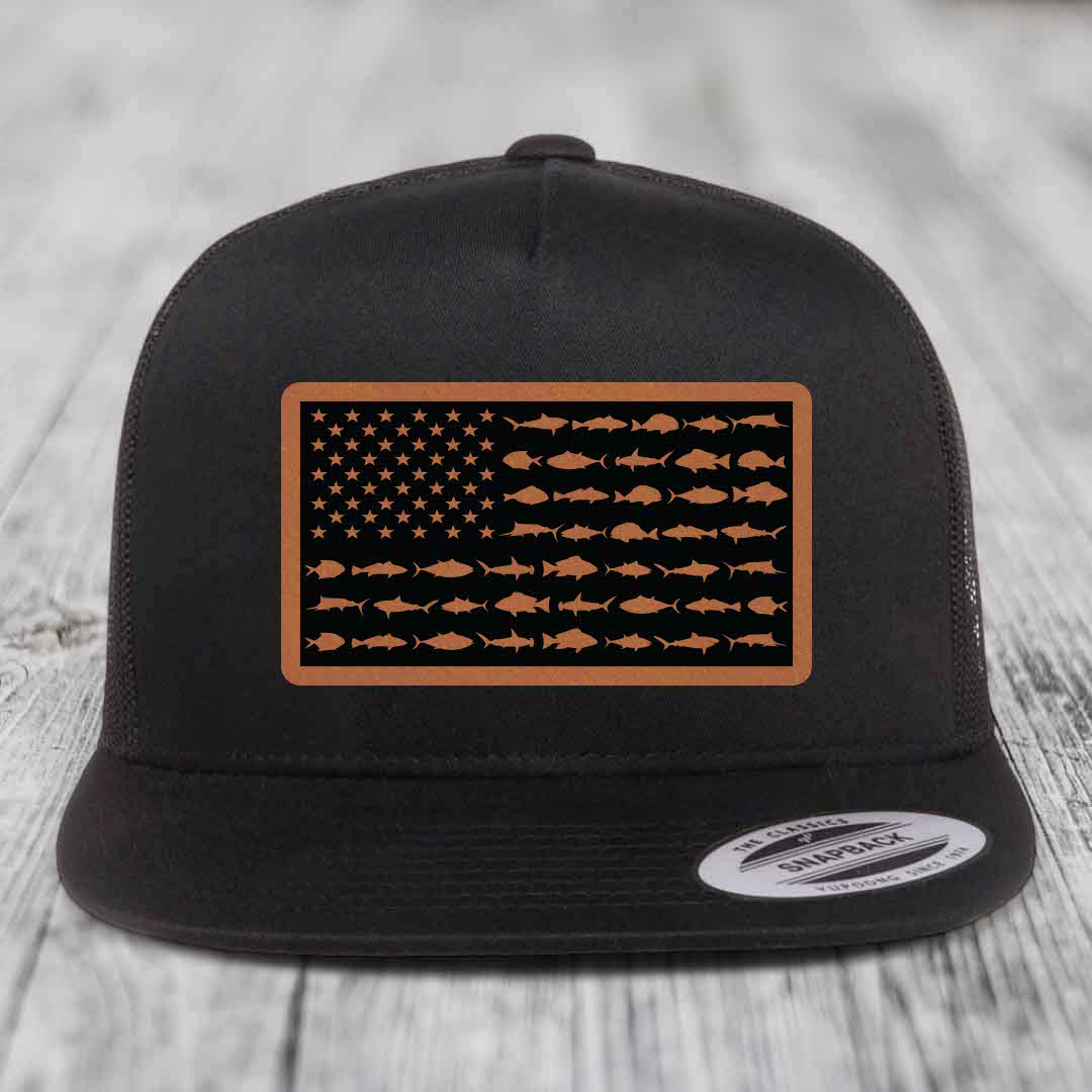 Black trucker hat with a brown leather patch featuring an American flag design made of fish silhouettes.