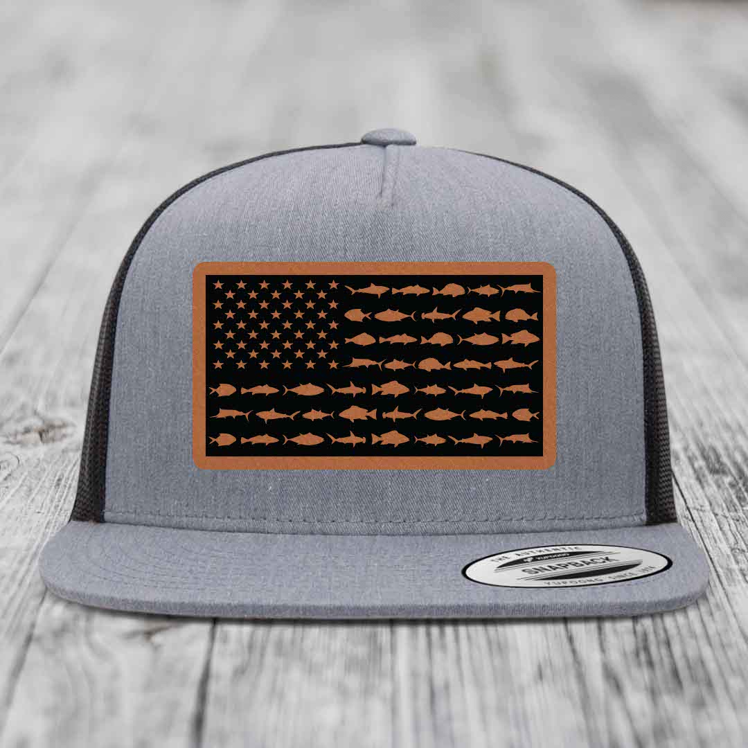 Grey trucker hat with American flag patch made of fish silhouettes and brown border.