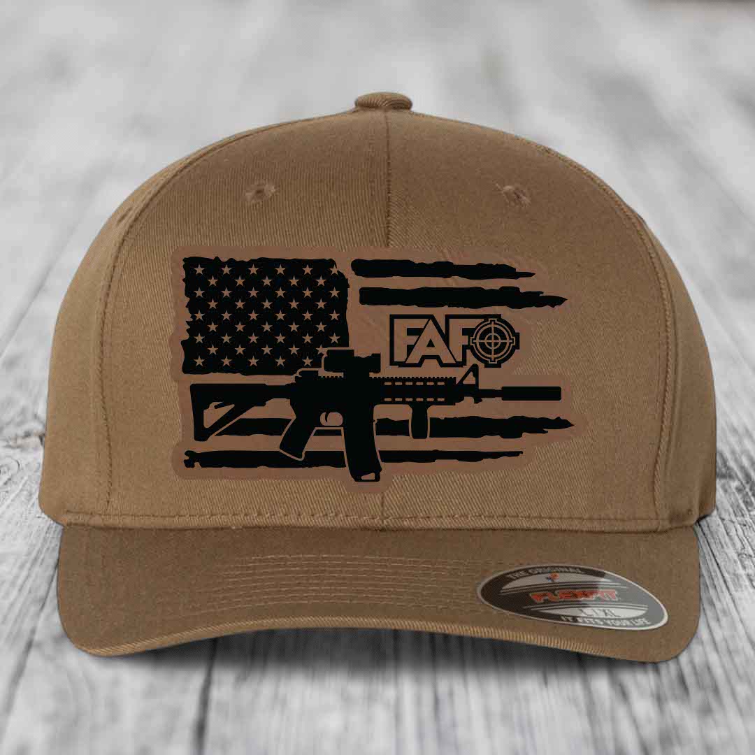 Tan baseball cap with black American flag and AR-15 graphic patch.