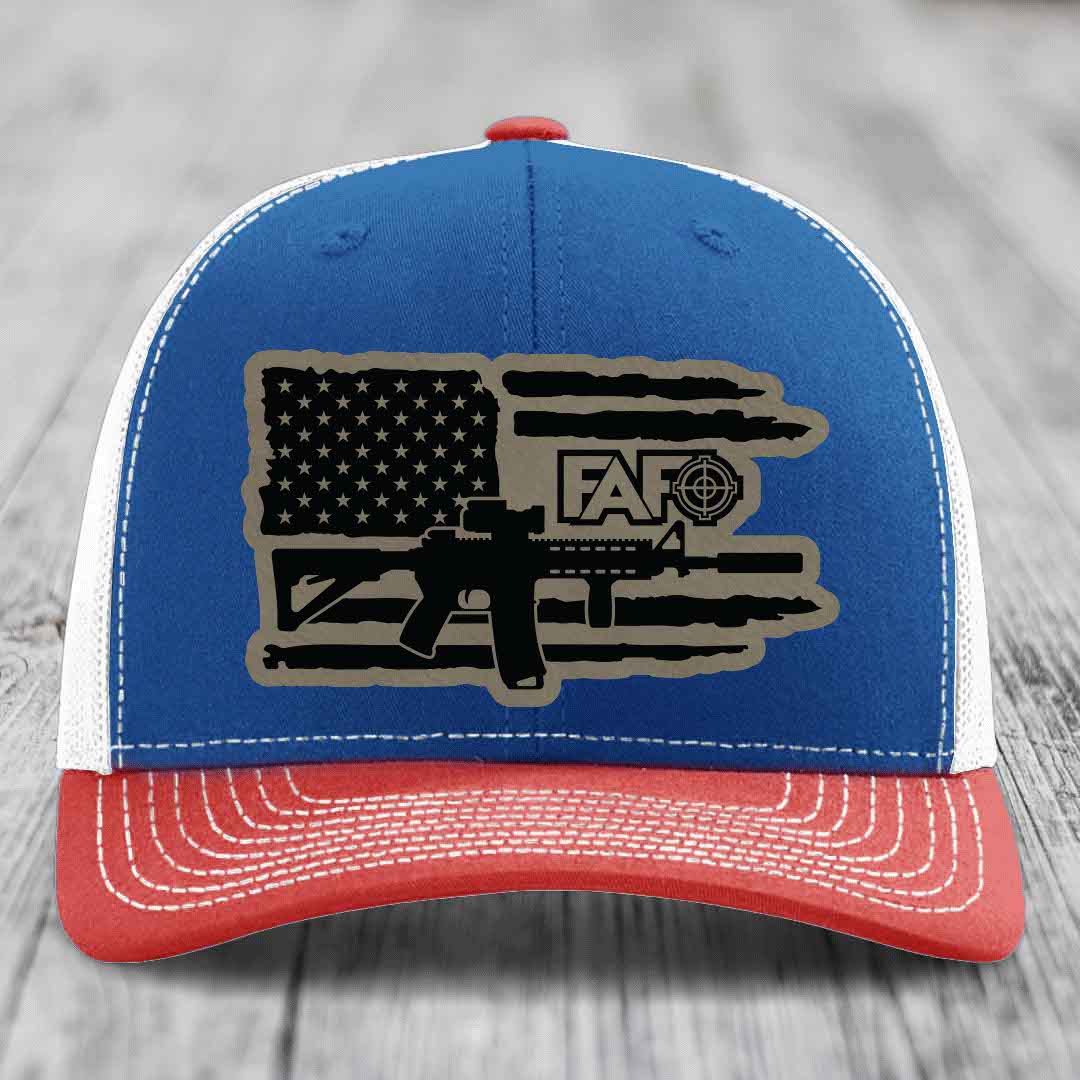 Blue and red trucker hat with American flag patch featuring AR15 and FAFO logo.