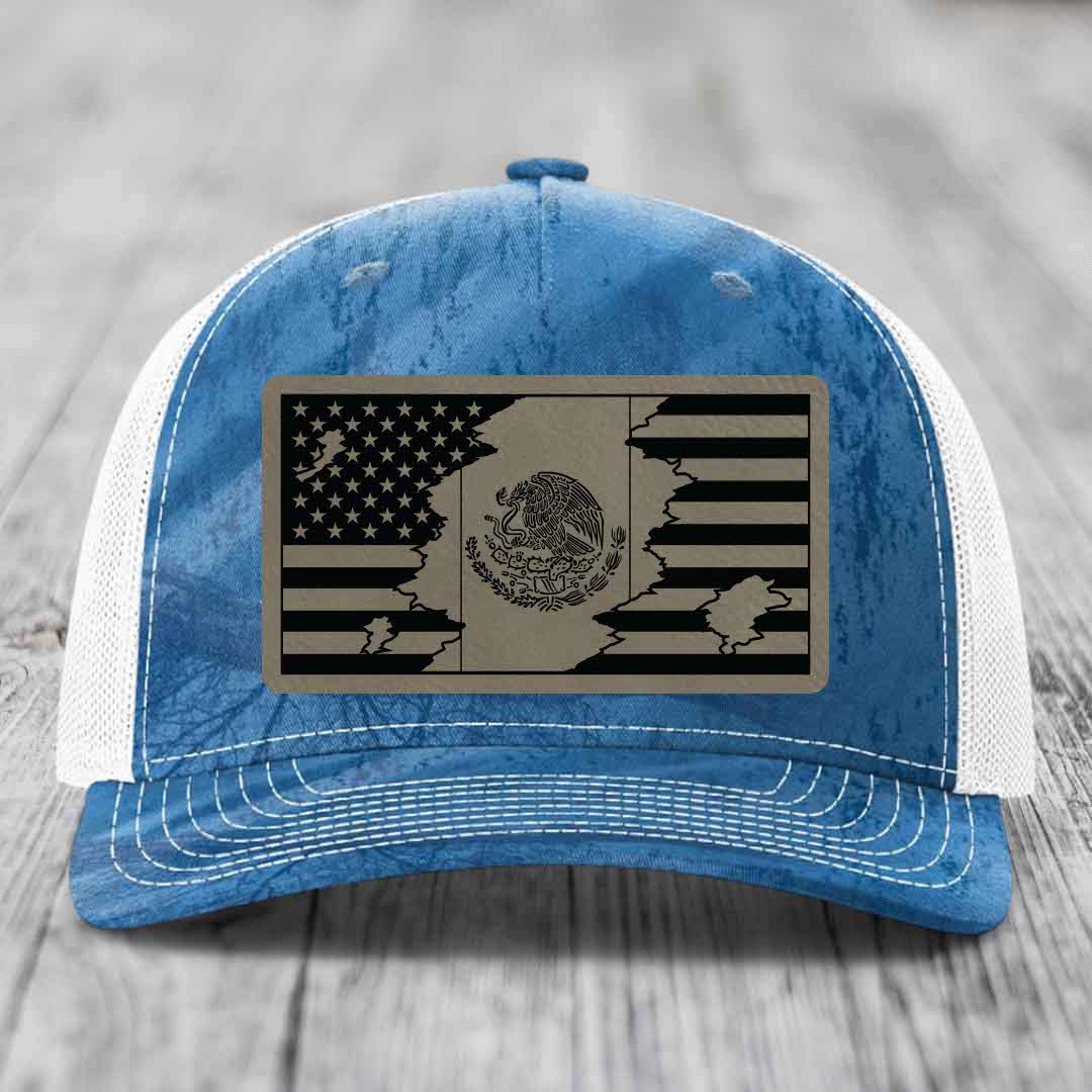 Blue and white trucker hat with a distressed American and Mexican flag patch on the front.