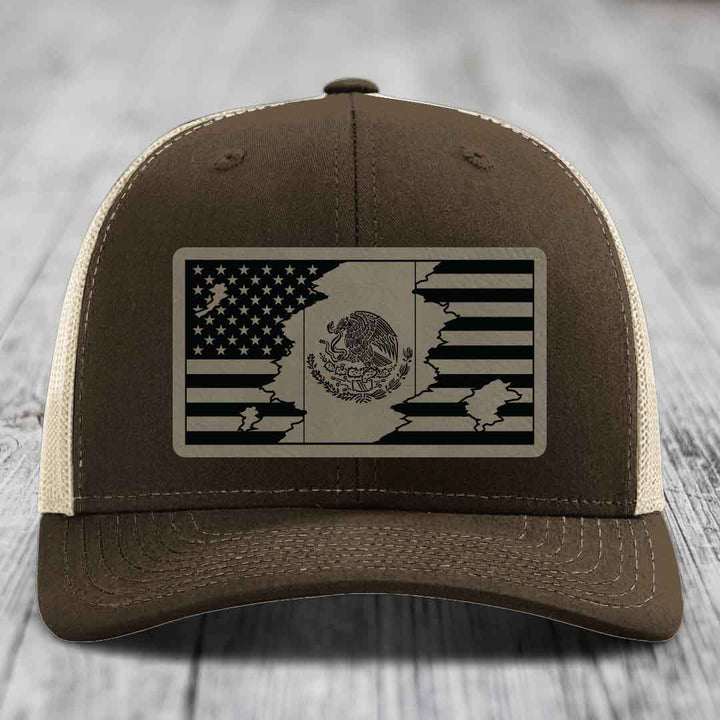 Brown trucker hat with a black and beige American-Mexican flag patch on the front.