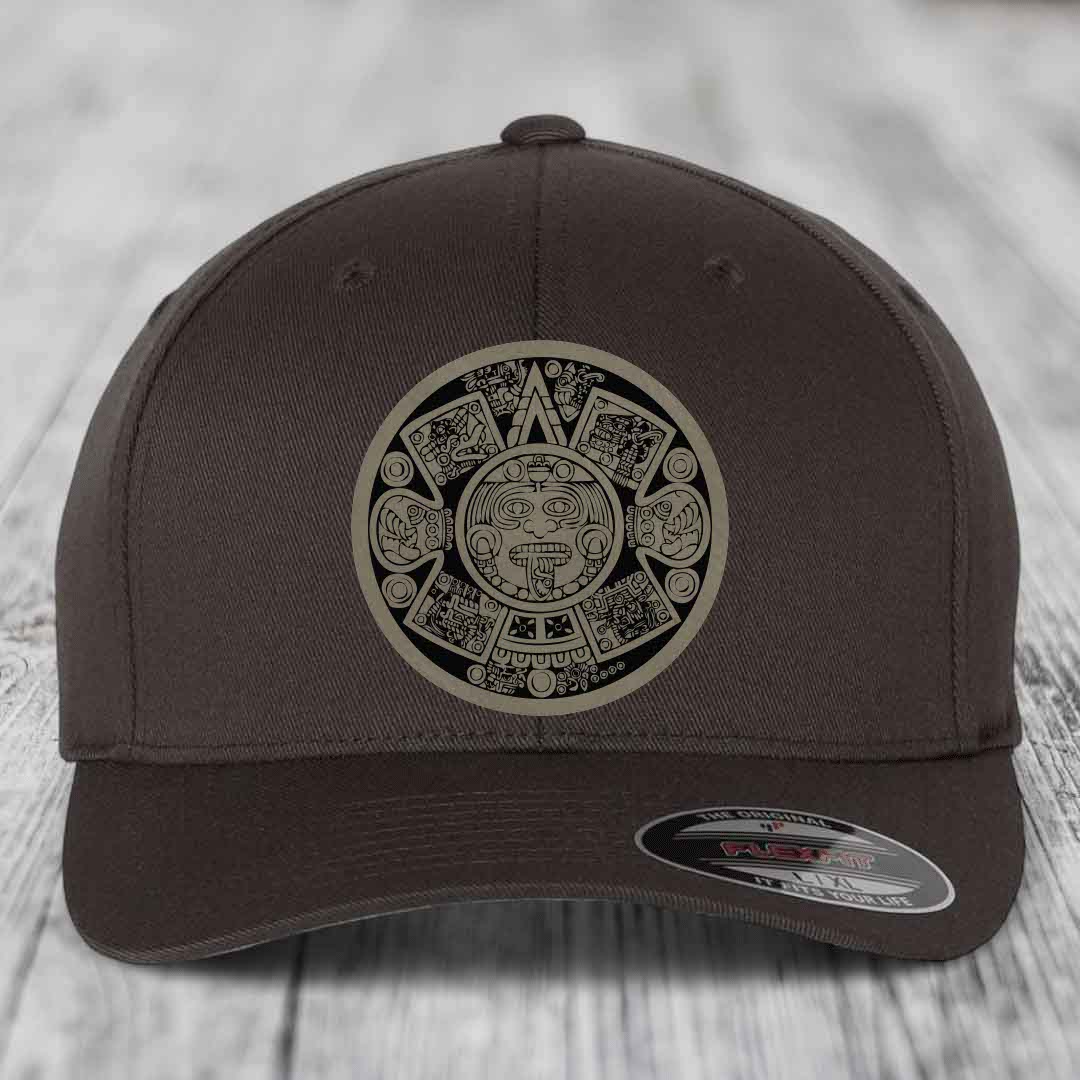 Brown baseball cap with Aztec calendar patch and Flexfit label on brim.