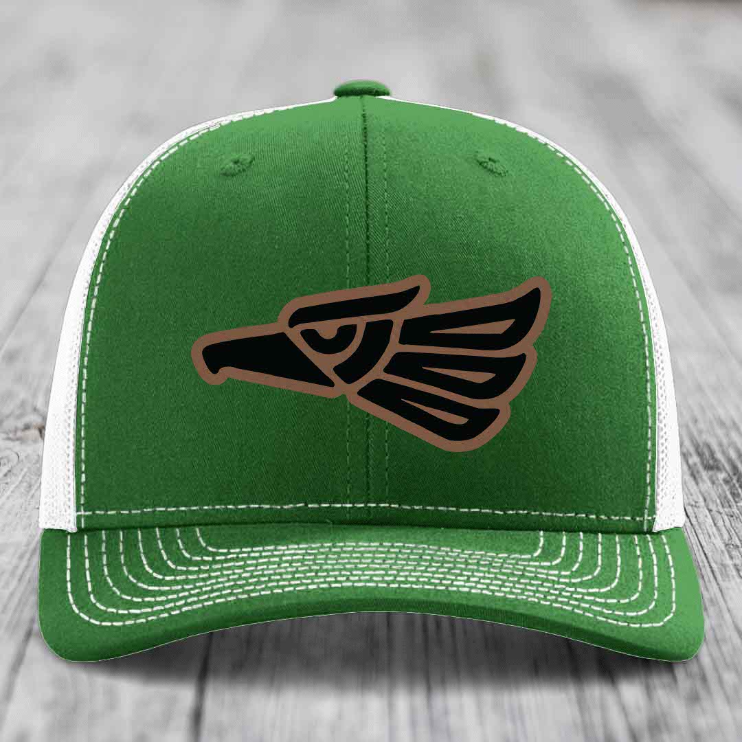 Green trucker hat with white mesh back and embroidered eagle patch in black and brown.