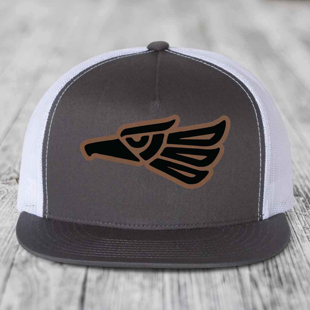 Grey trucker hat with black and brown Aztec eagle patch on front.