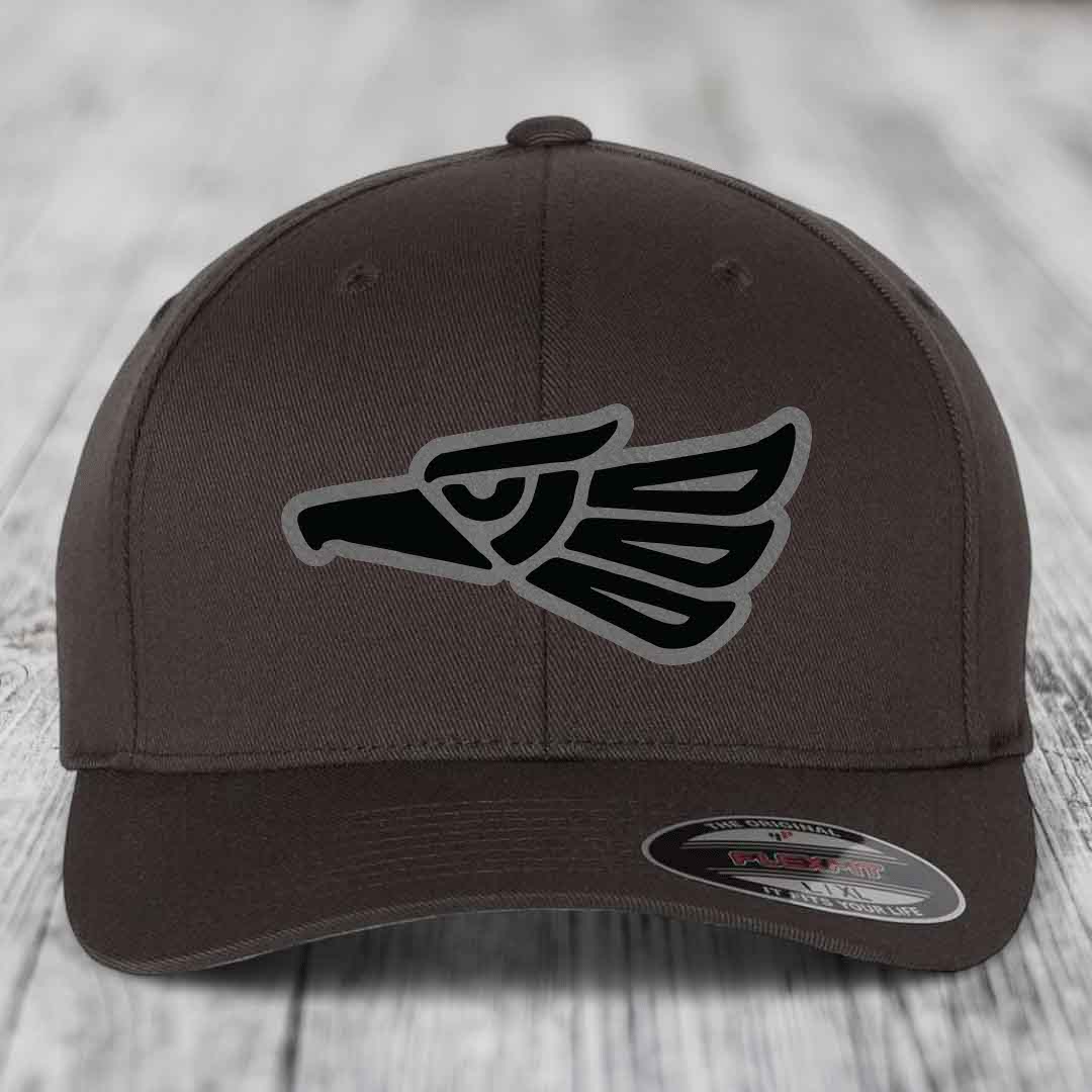 Brown Flexfit hat with black and grey Aztec eagle patch on front.