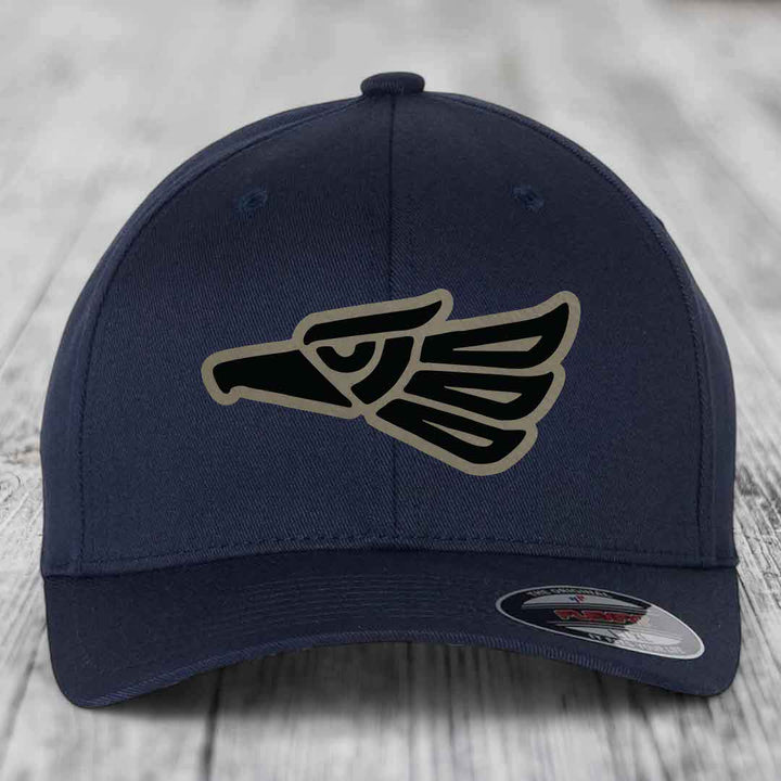 Dark blue baseball cap with embroidered Aztec-style eagle patch on front.