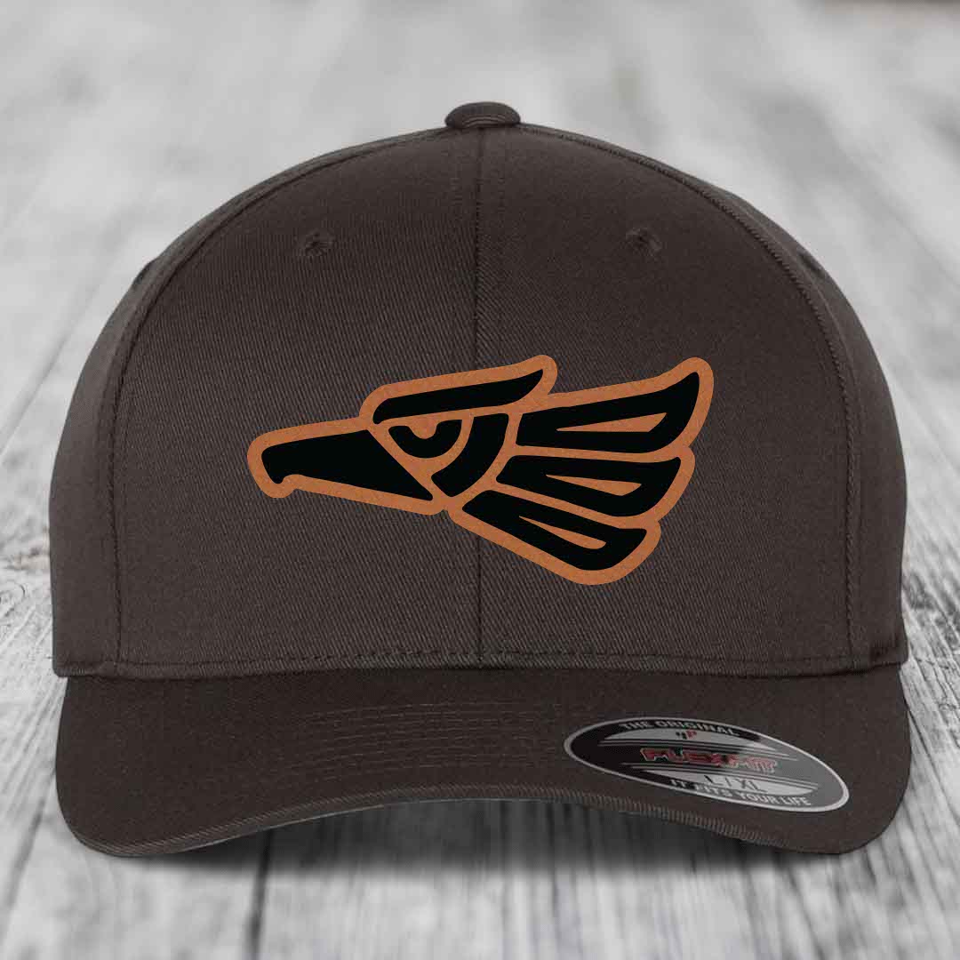 Brown Flexfit hat with Aztec-style eagle patch in black and tan leatherette.