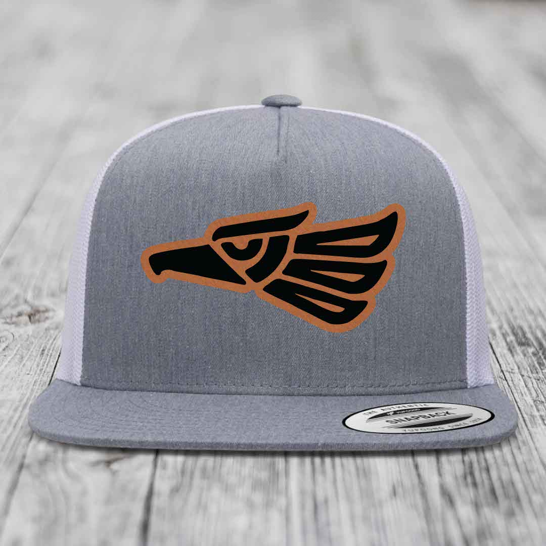 Grey snapback hat with black and tan Aztec eagle leather patch on front.