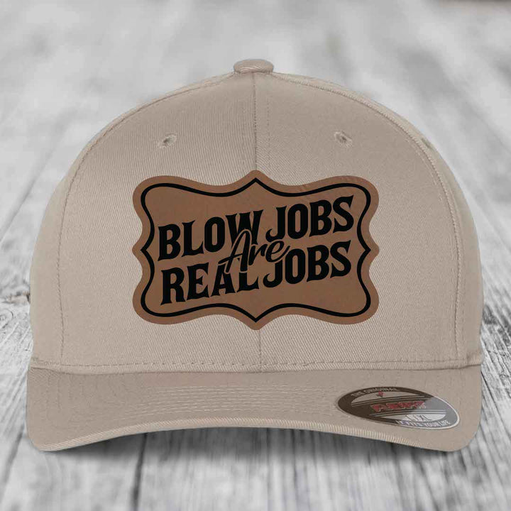 Beige baseball cap with brown leatherette patch reading &