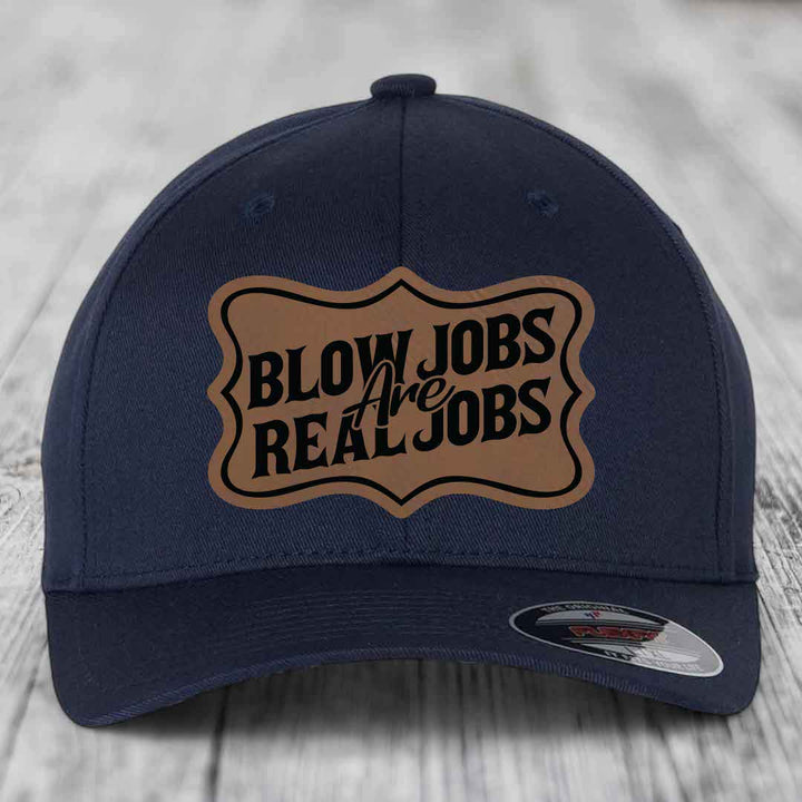Dark blue baseball cap with a brown leatherette patch that reads &