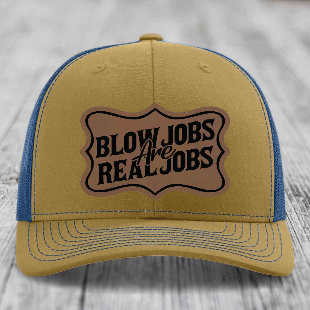 Tan and blue trucker hat with a brown leatherette patch that reads &