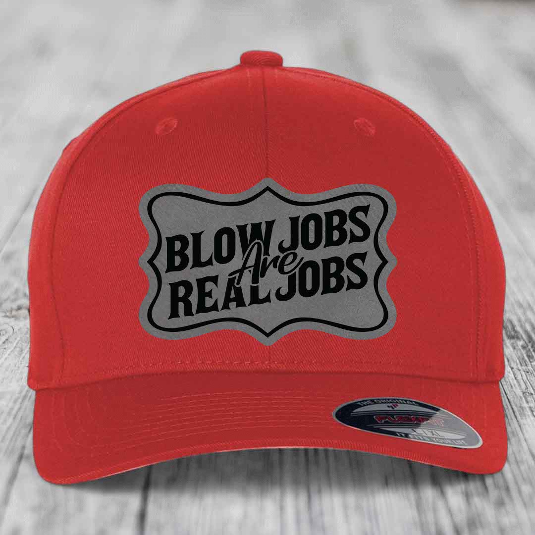 Red baseball cap with gray shield patch reading &