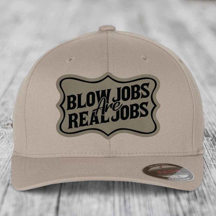 Beige baseball cap with black &