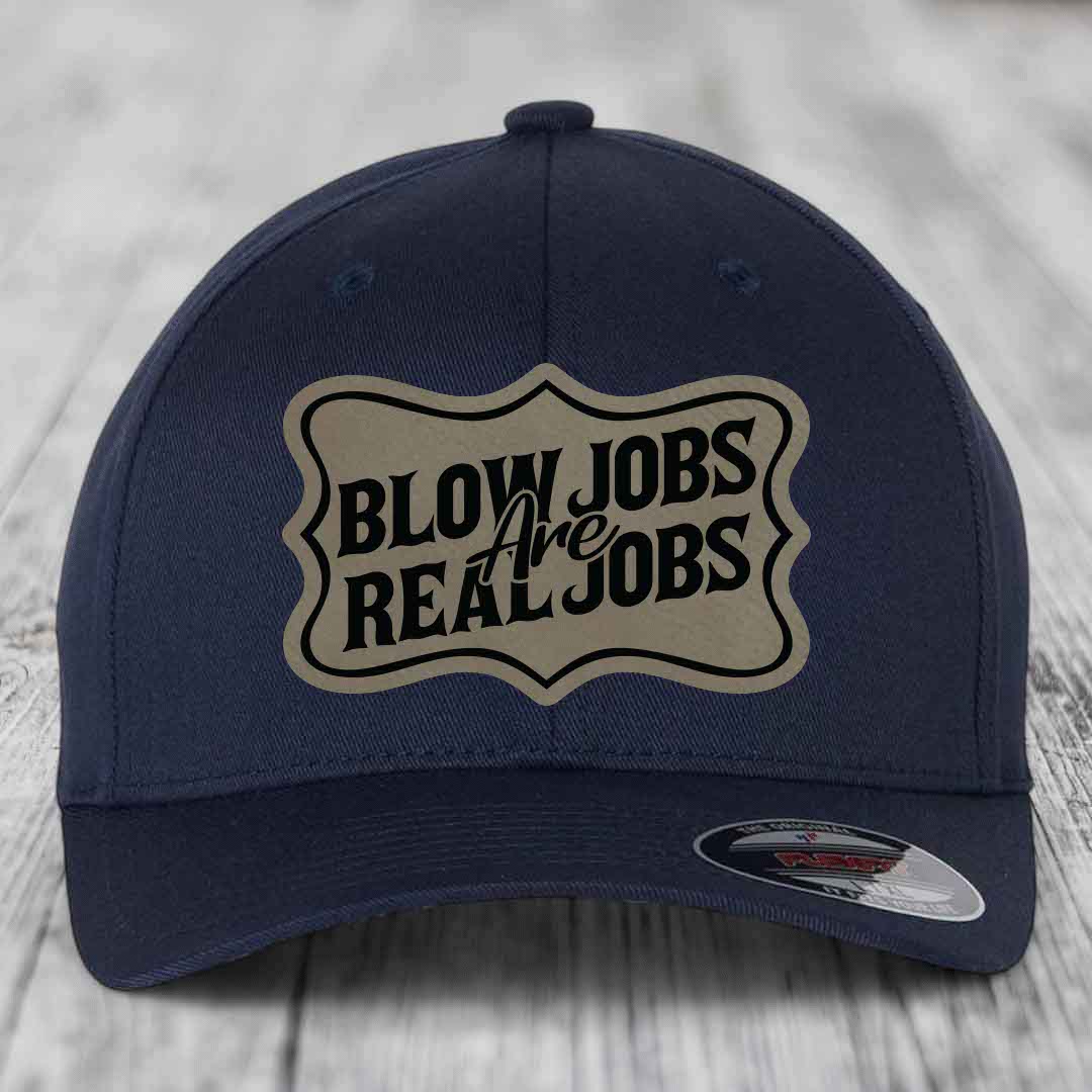 Dark blue baseball cap with a beige shield patch reading &