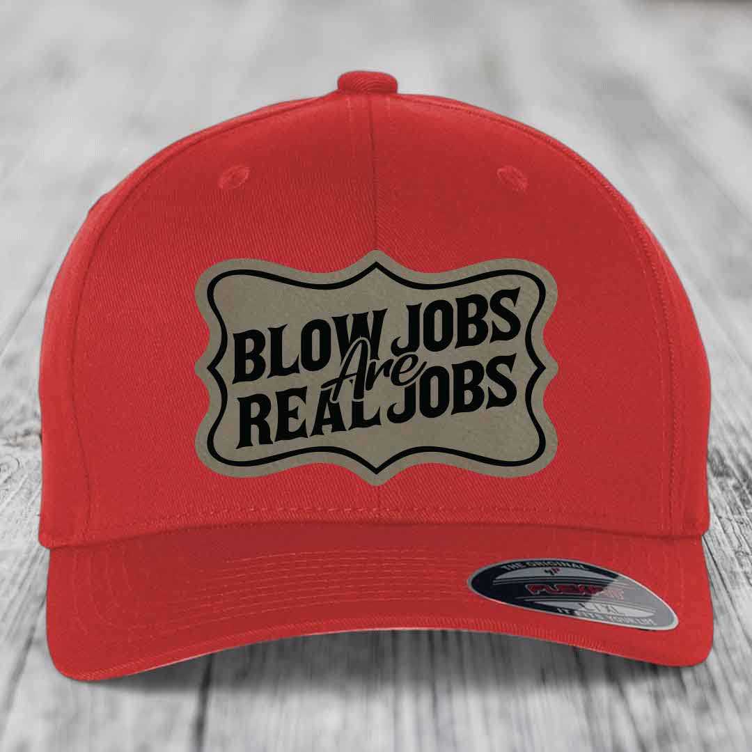 Red baseball cap with a beige shield patch that reads &