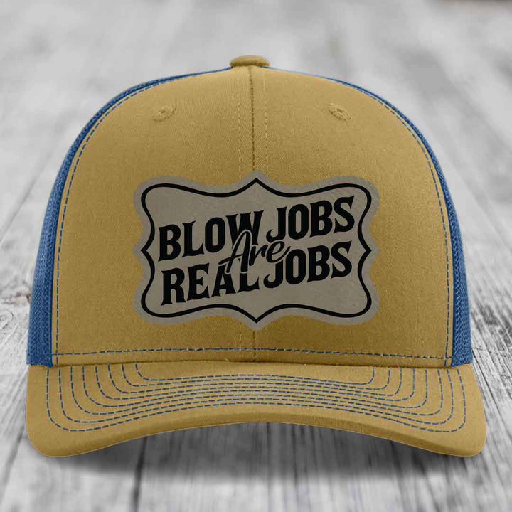Tan and blue trucker hat with &
