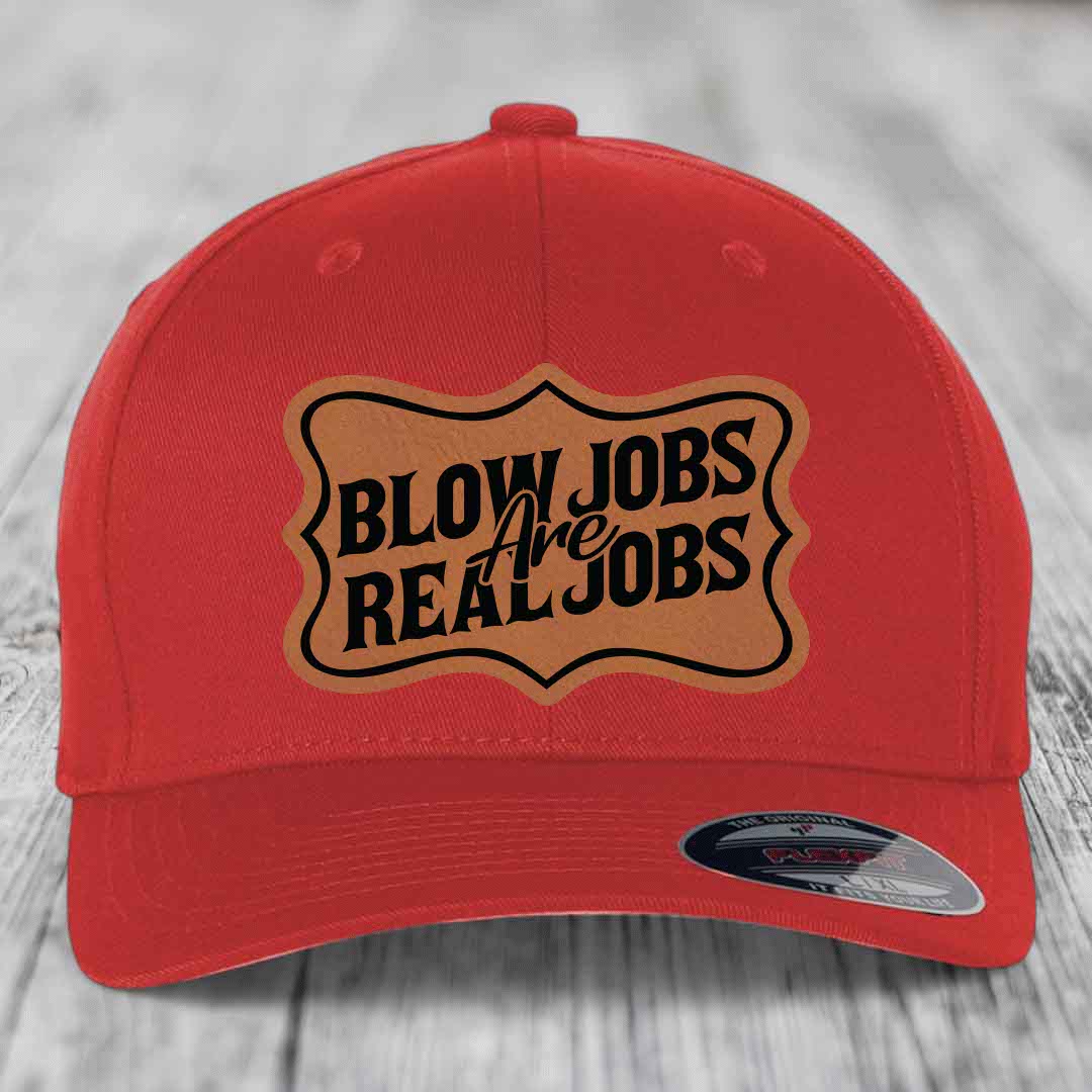 Red baseball cap with brown leatherette patch reading &