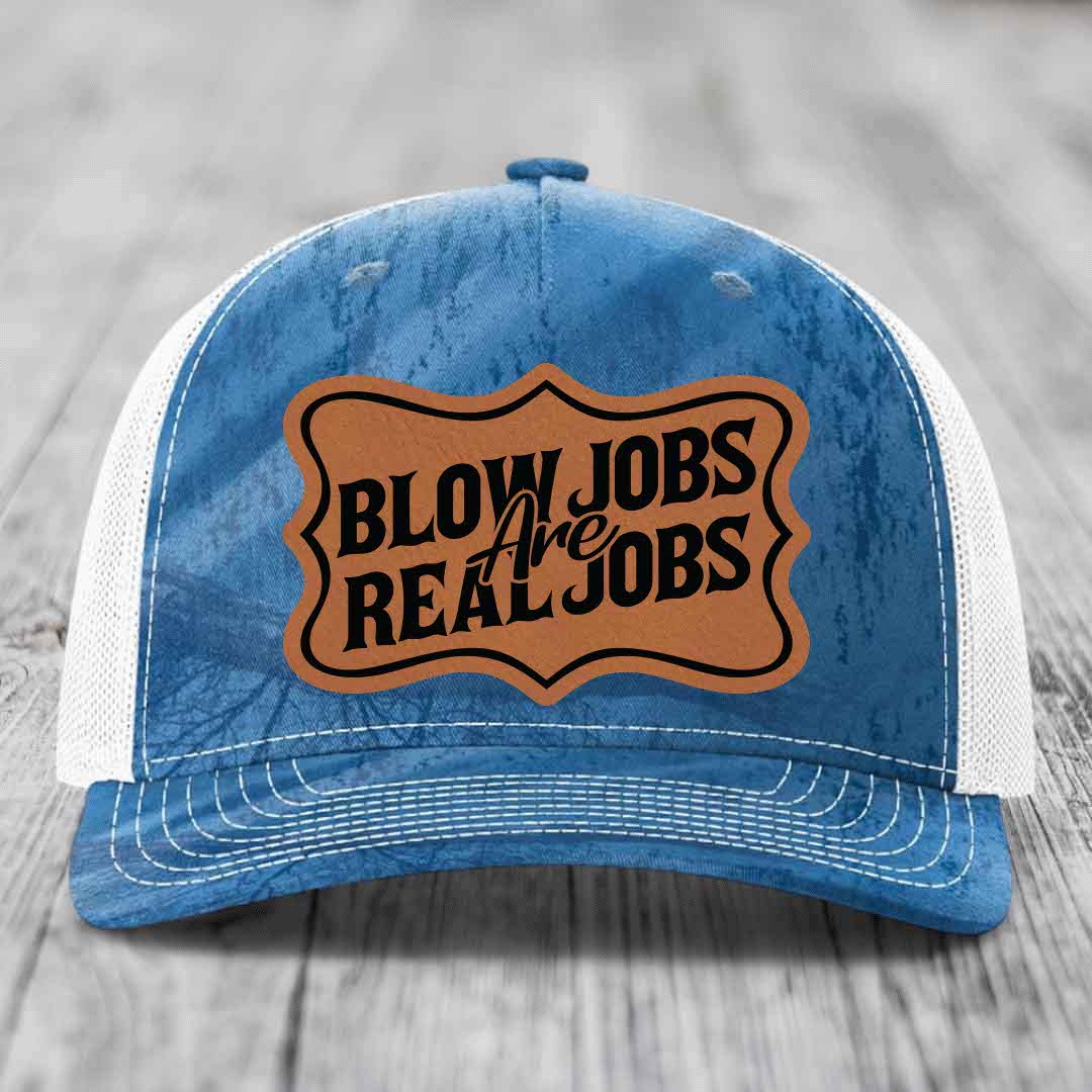 Blue and white trucker hat with brown leather patch reading &
