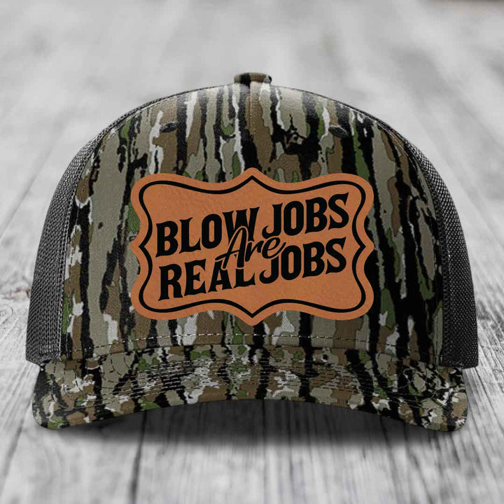 Camouflage trucker hat with brown leatherette patch reading &