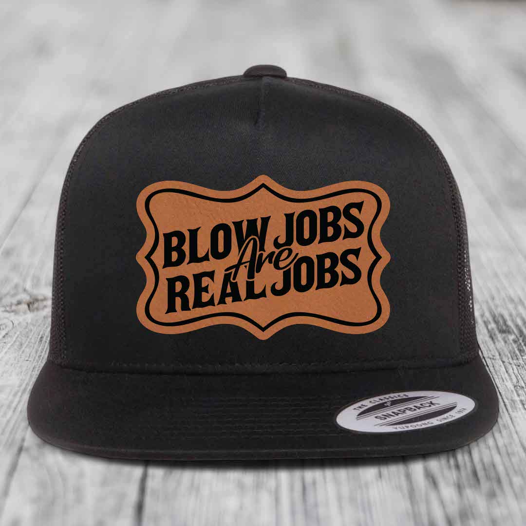Black snapback hat with brown leatherette patch reading &
