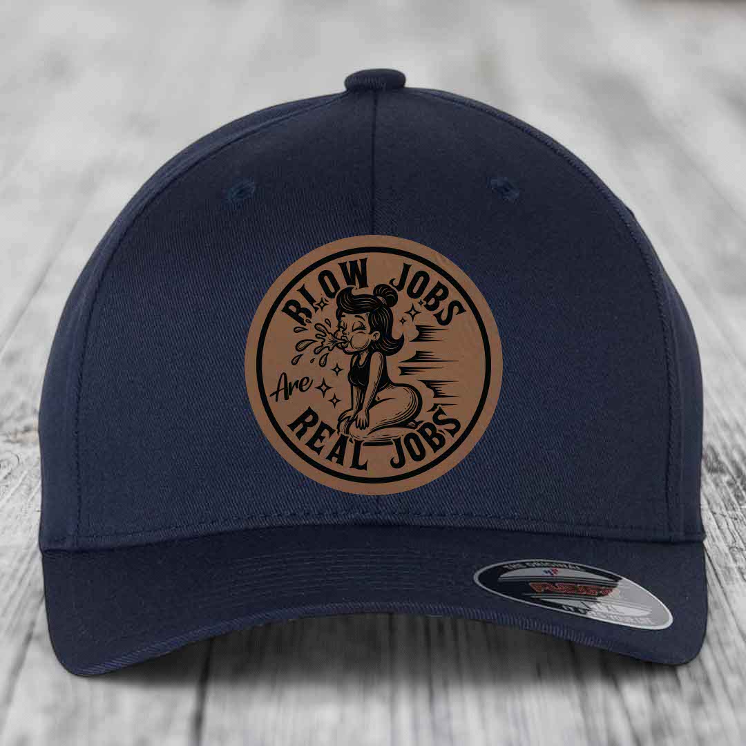 Dark blue baseball cap with circular brown leatherette patch reading &