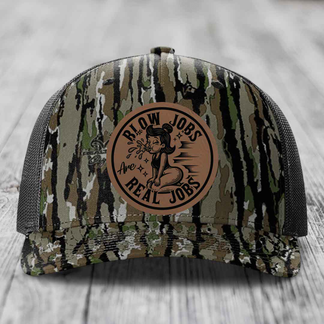 Camouflage trucker hat with brown leather patch reading &