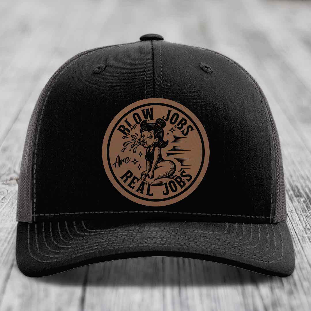 Black trucker hat with brown circular patch reading &