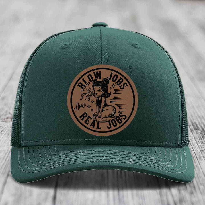 Green trucker hat with brown circular leather patch reading &