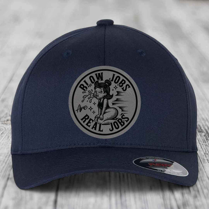 Dark blue baseball cap with circular patch reading &