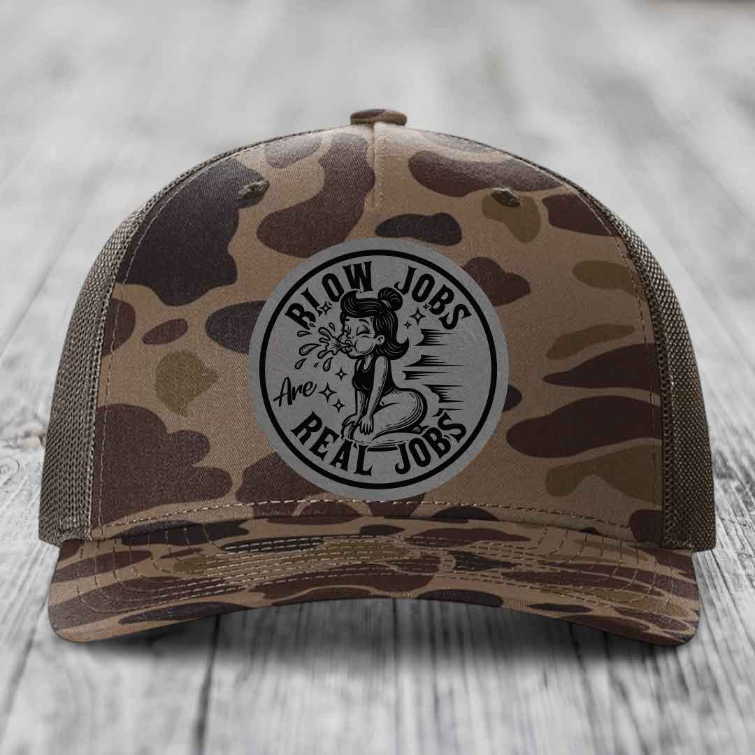 Camouflage trucker hat with a circular patch reading &