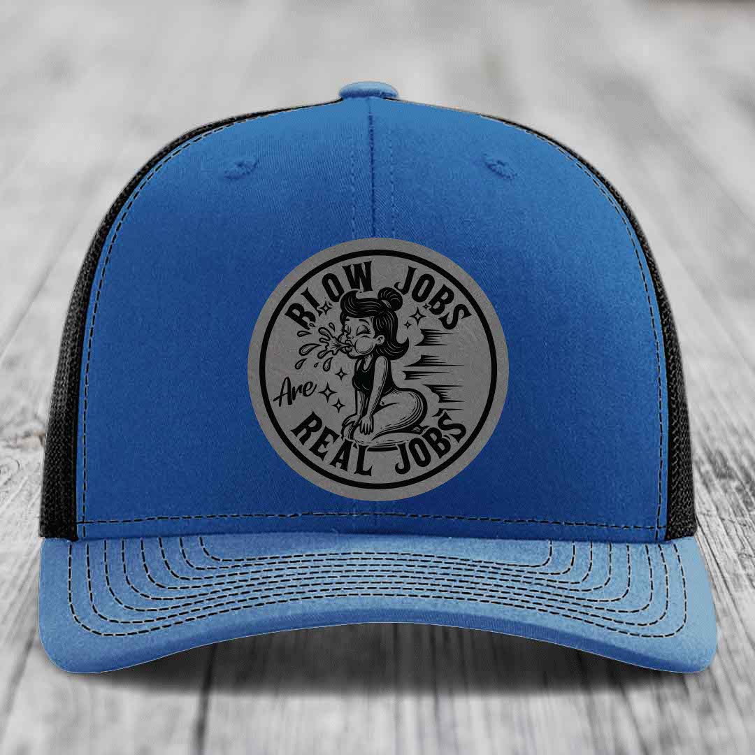 Blue trucker hat with black mesh back and gray circular patch reading &