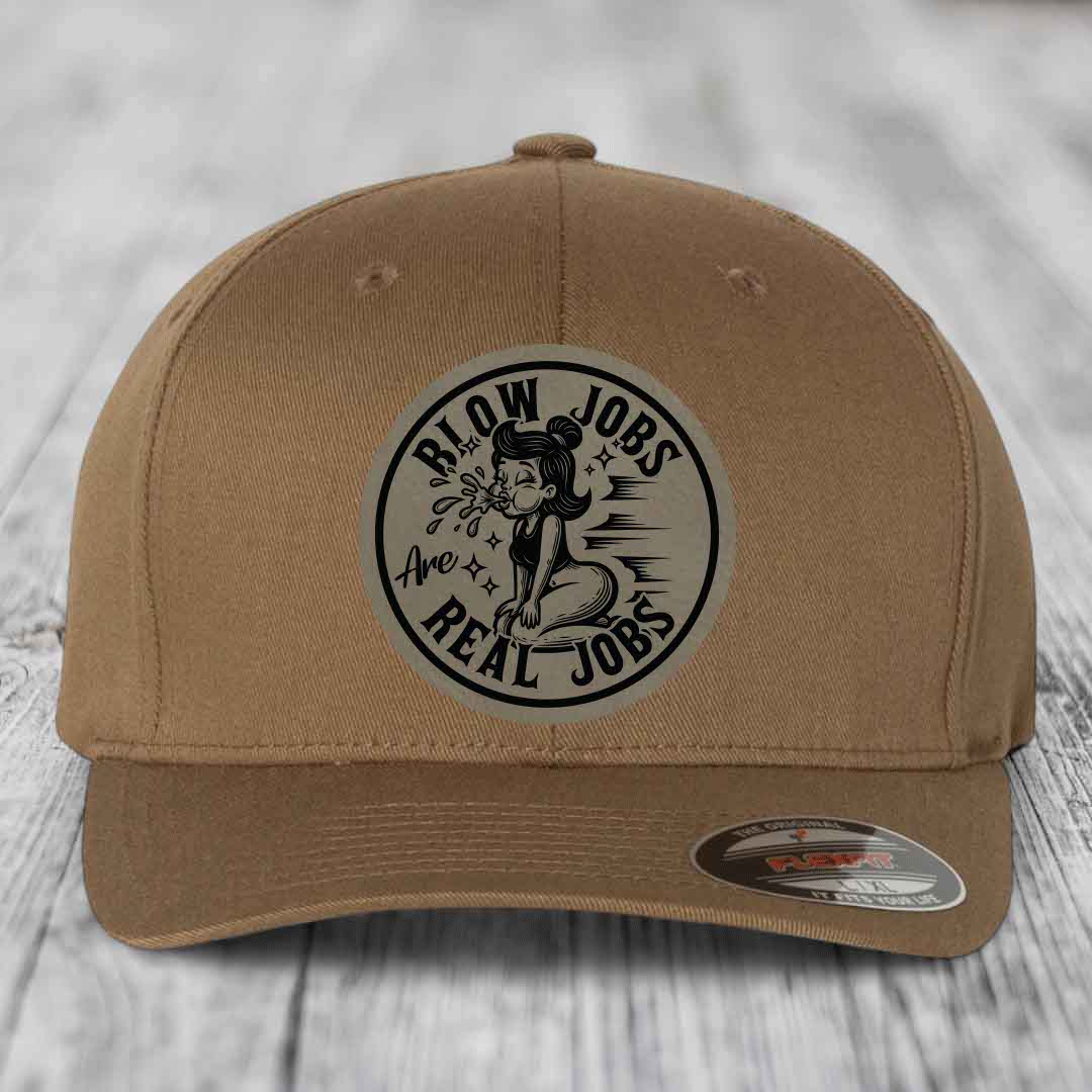 Tan baseball cap with circular black and white patch reading &