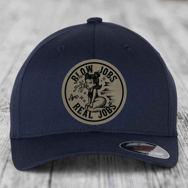 Dark blue baseball cap with circular beige patch reading &