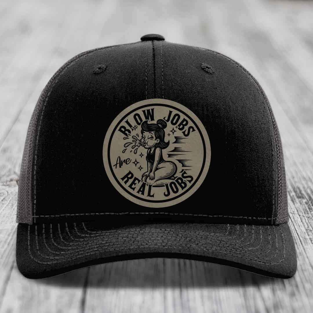 Black trucker hat with circular beige patch reading &