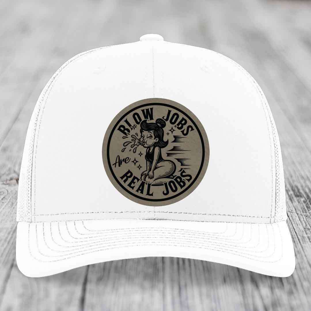 White trucker hat with a circular leatherette patch featuring text and illustration.
