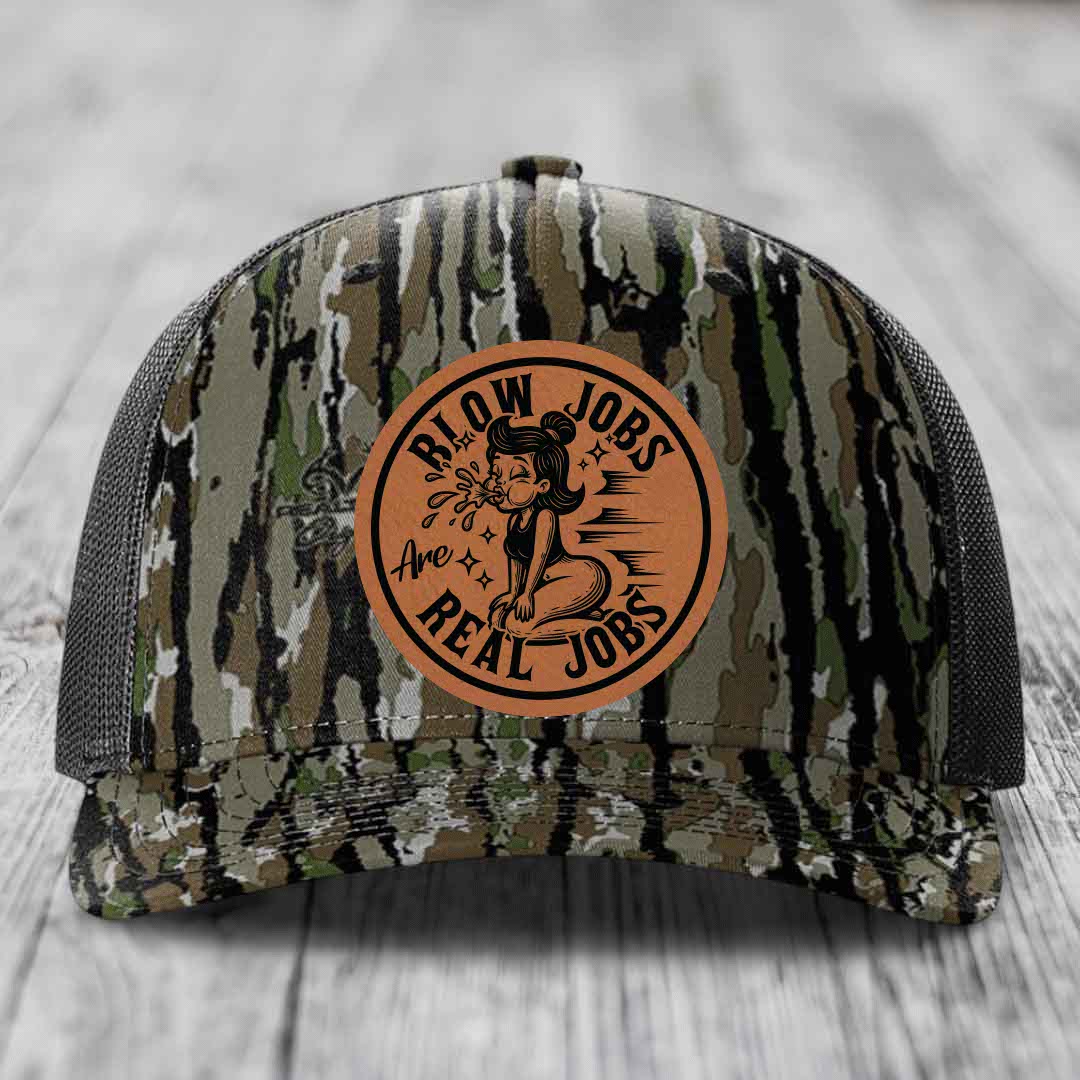 Camouflage trucker hat with brown leather patch reading &