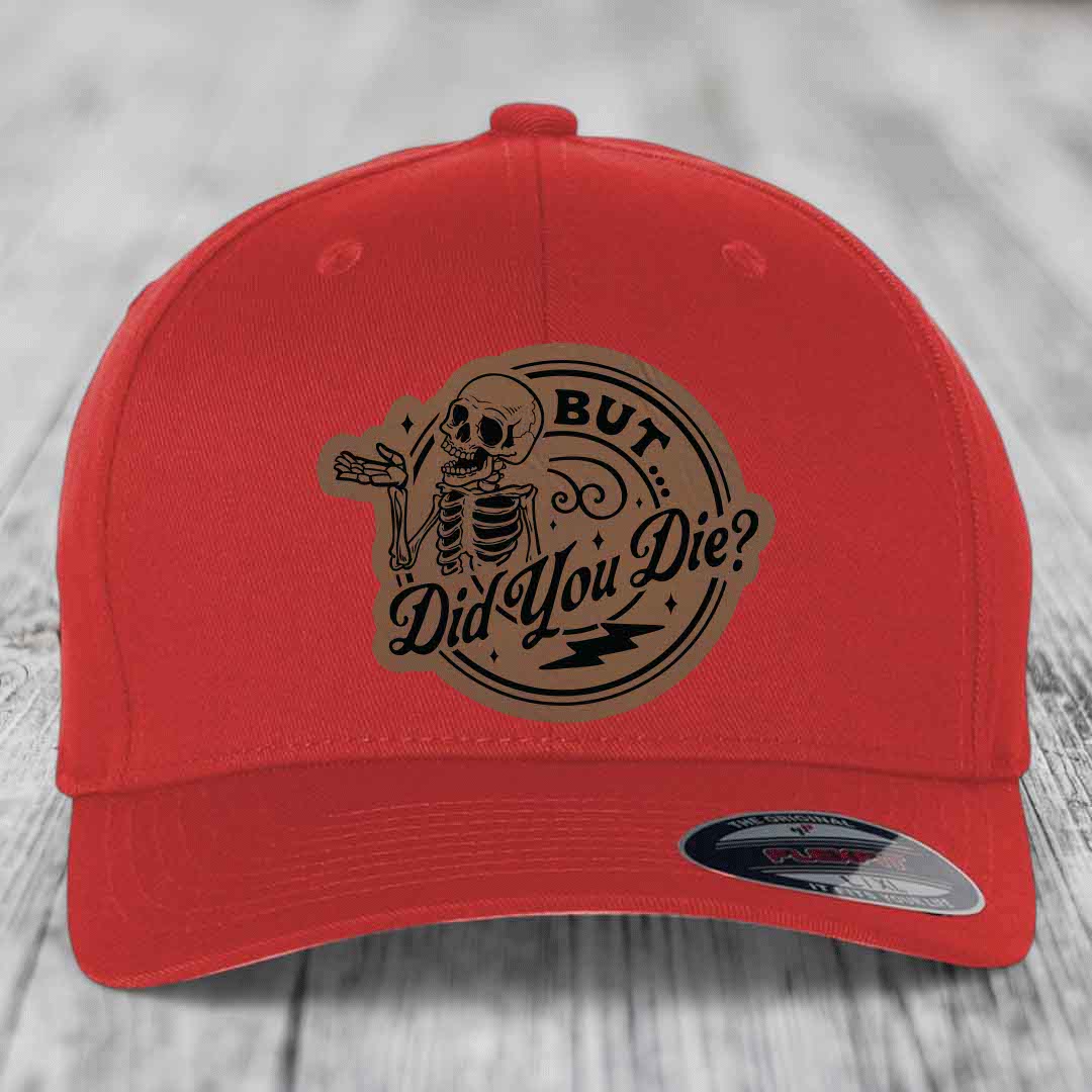 Red baseball cap with a brown leatherette patch featuring a skeleton and the text &