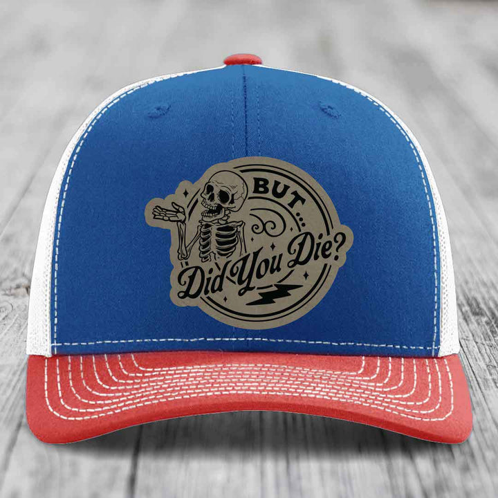 Blue and red trucker hat with a skeleton graphic and &