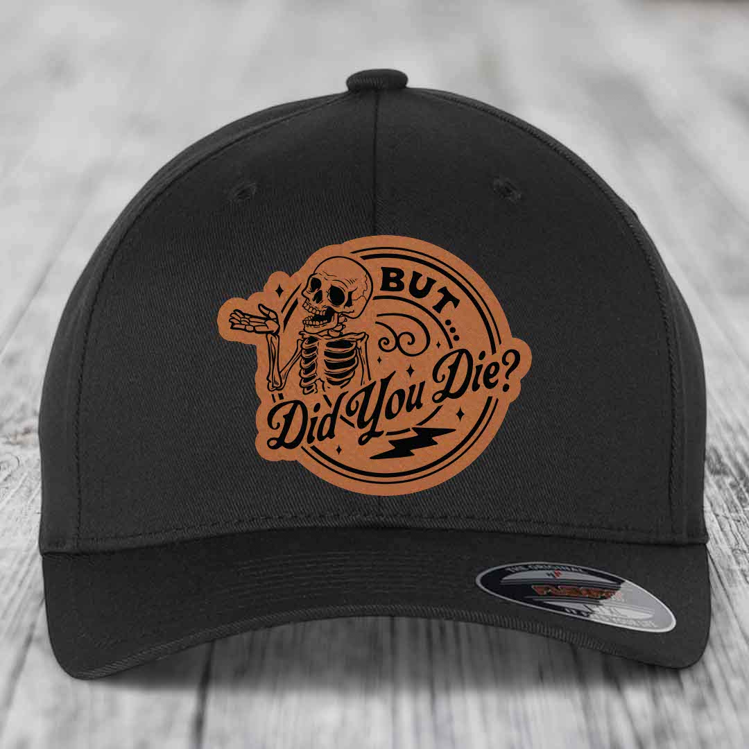 Black baseball cap with brown leather patch featuring skeleton and text &