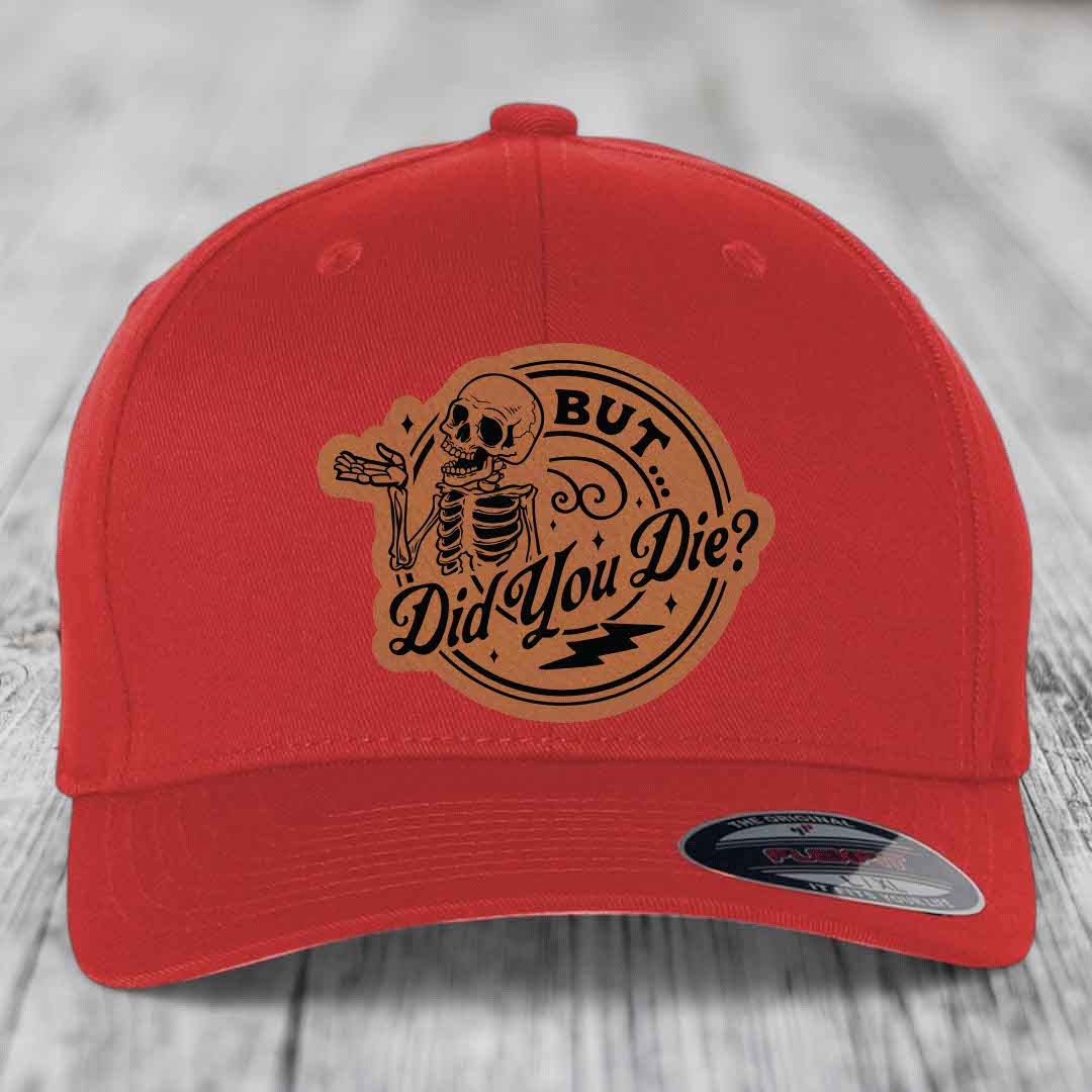 Red baseball cap with a brown leatherette patch featuring a skeleton and the text &