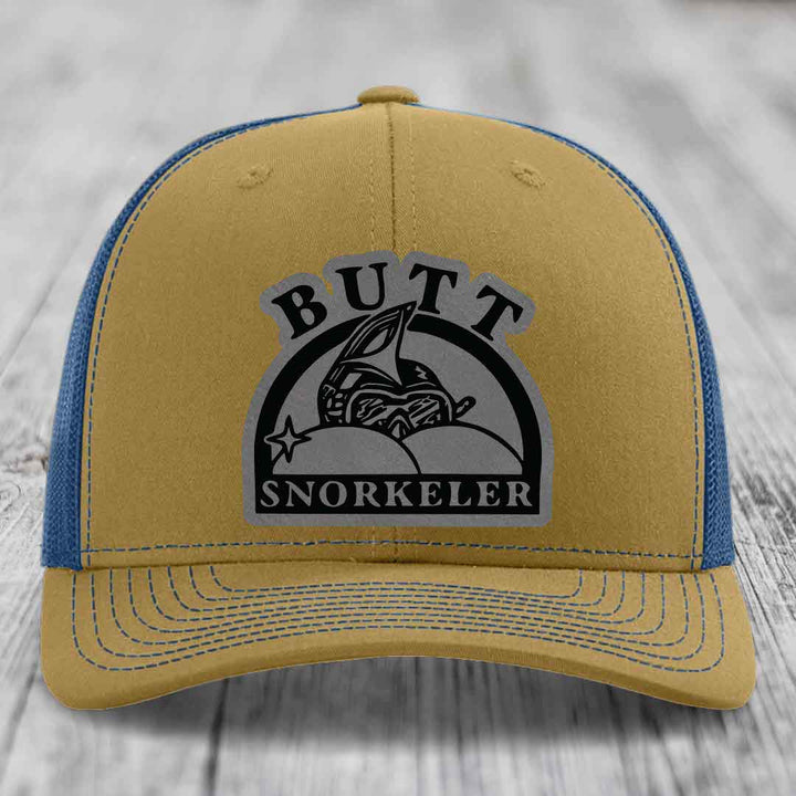 Tan and blue trucker hat with &