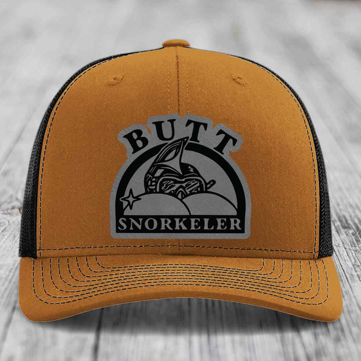 Tan trucker hat with black mesh back and gray &