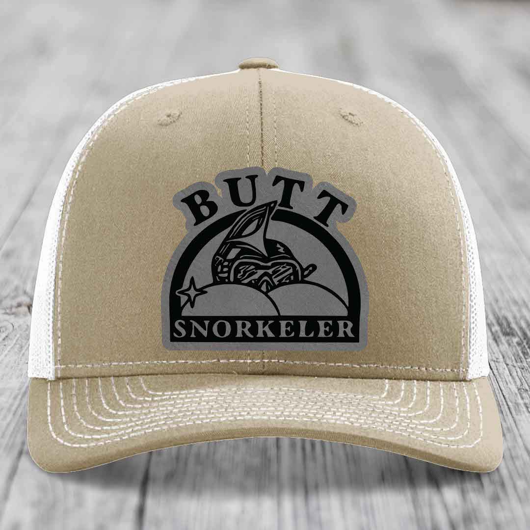 Tan trucker hat with white mesh back and embroidered &