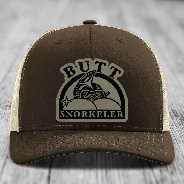 Brown trucker hat with beige mesh back and &