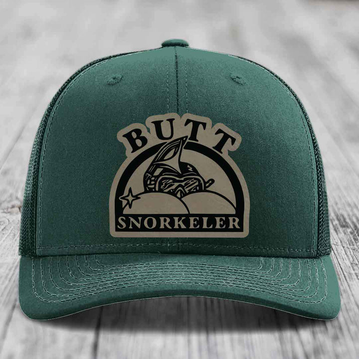 Green trucker hat with a beige and black &
