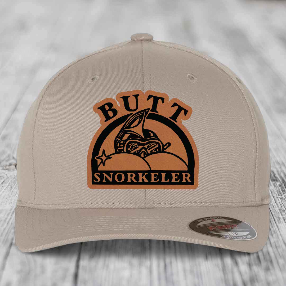 Beige baseball cap with brown leatherette patch reading &