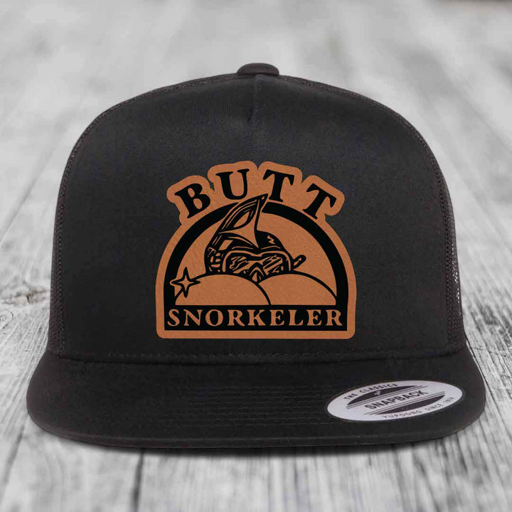 Butt Snorkeler - Leather Patch Hat - Rawhide to Black Patch - Yupoong 6006 Snapback Flatbill Hat