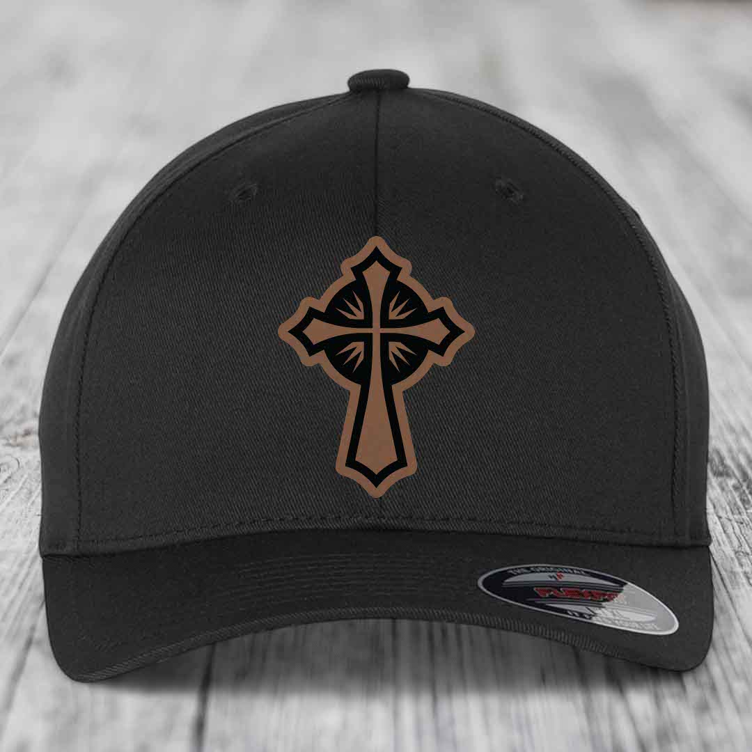 Black baseball cap with a brown and black cross leather patch on the front.