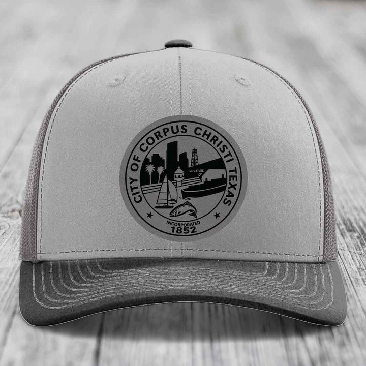 Corpus Christi Seal - Leather Patch Hat - Grey to Black Patch - Richardson 112 Snapback Trucker Hat